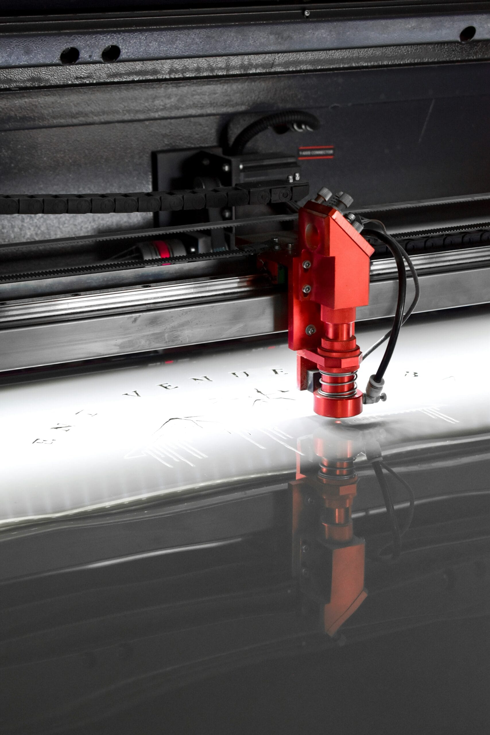 red laser engraving machine in operation